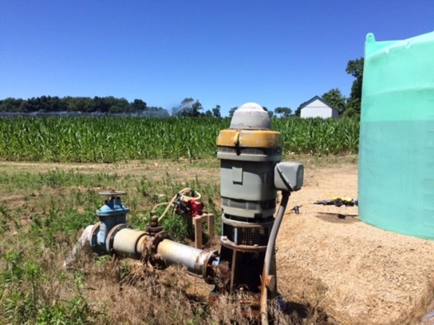 A fertigation injection pump in a corn field.